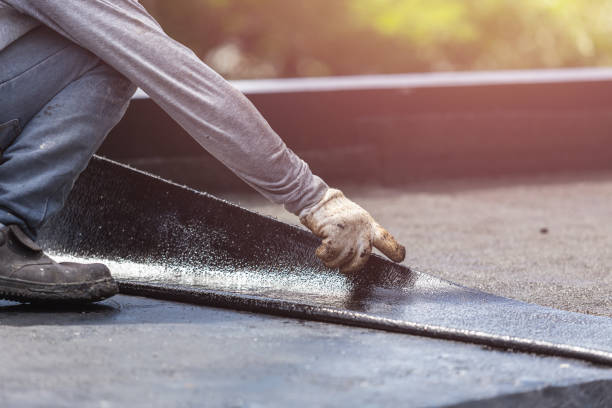 Professional Waterproofing technician working in Russellville, AL